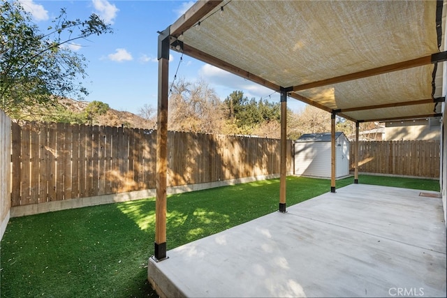 view of patio with a storage shed