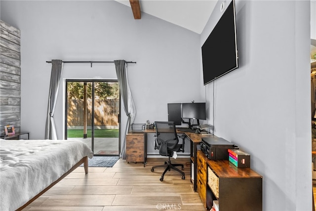 bedroom featuring access to exterior and vaulted ceiling with beams