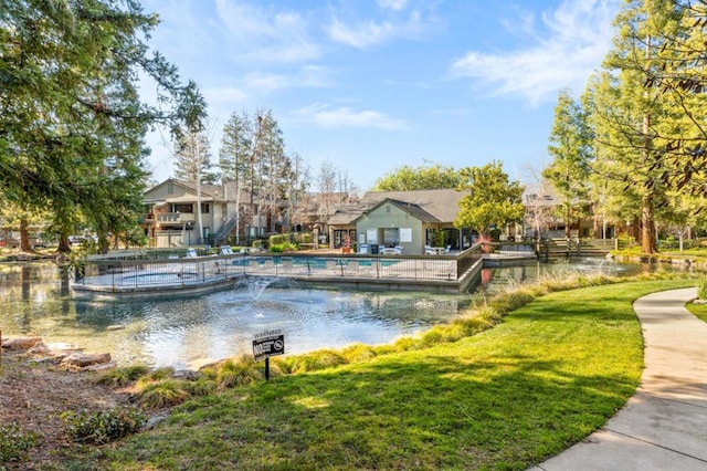 view of pool featuring a yard