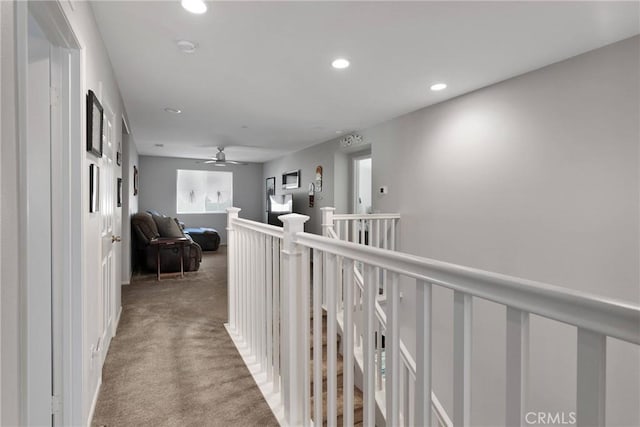 hallway with carpet flooring