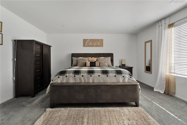 bedroom with dark carpet