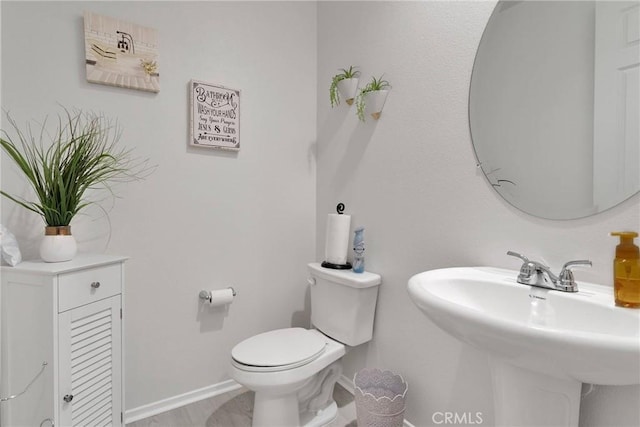 bathroom with sink and toilet