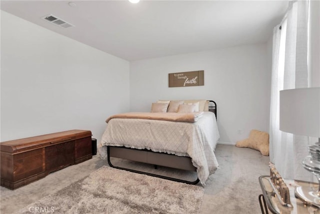 bedroom featuring light carpet