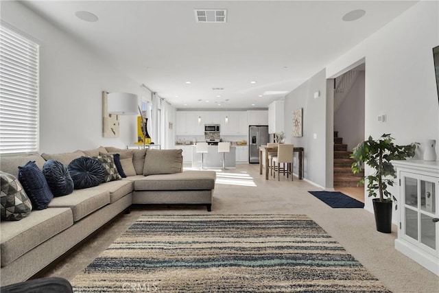 living room featuring carpet flooring