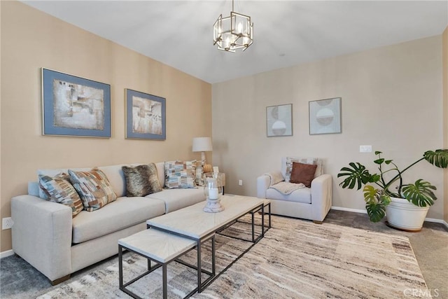 living room featuring carpet flooring and an inviting chandelier