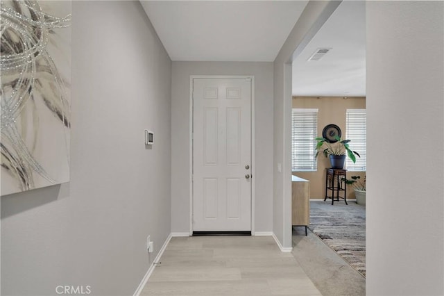 foyer with light carpet