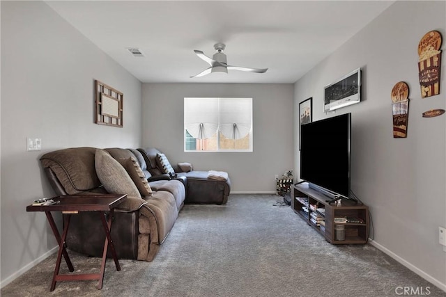 carpeted living room featuring ceiling fan