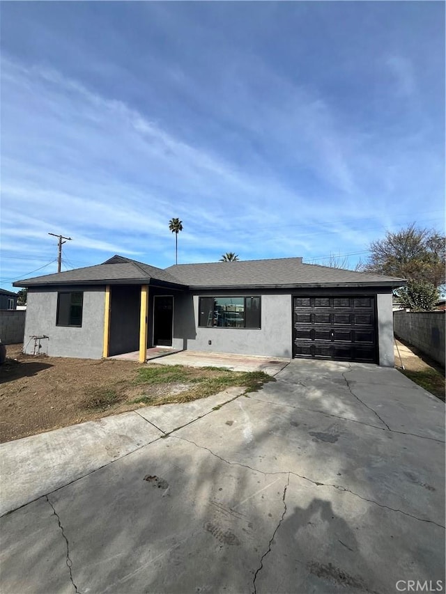 single story home featuring a garage