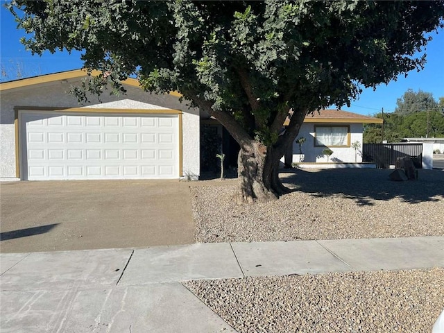 single story home featuring a garage