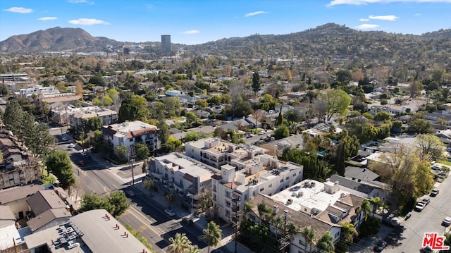 birds eye view of property with a mountain view