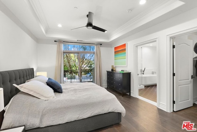 bedroom with ceiling fan, connected bathroom, a tray ceiling, and access to outside