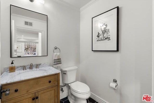 bathroom with crown molding, toilet, and vanity