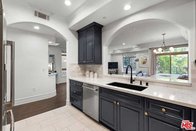 kitchen featuring dishwasher, sink, ornamental molding, backsplash, and light stone counters