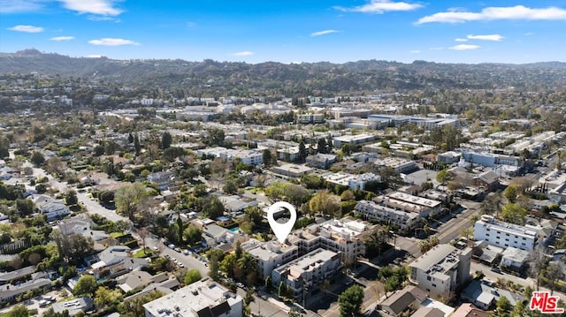 drone / aerial view featuring a mountain view