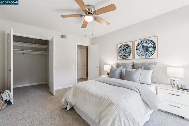 bedroom featuring ceiling fan, a closet, and light carpet