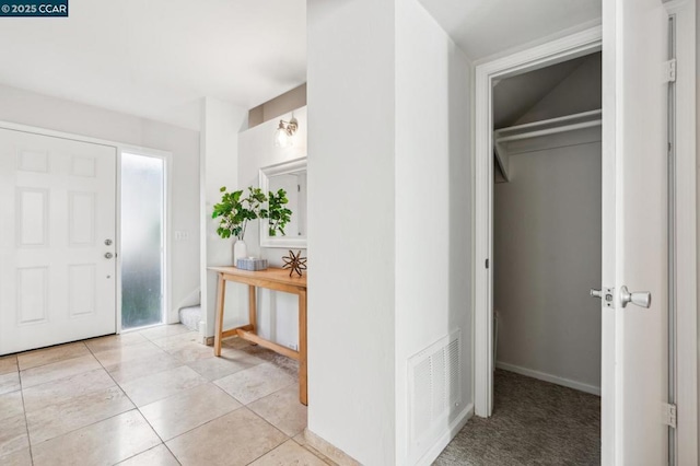 view of tiled foyer entrance