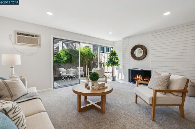 living room with carpet flooring and a wall unit AC