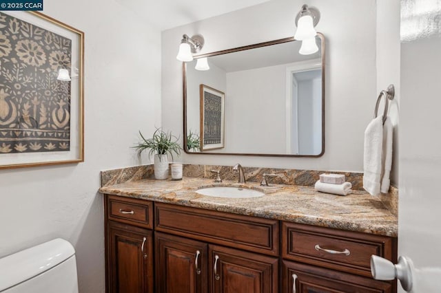 bathroom with vanity and toilet