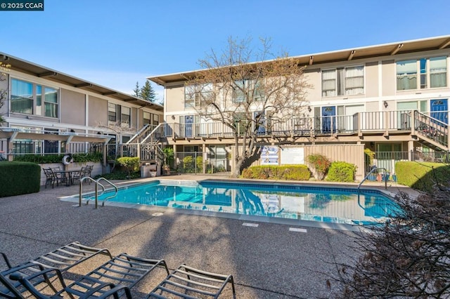 view of pool featuring a patio area