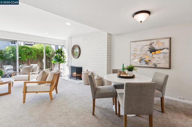 view of carpeted dining space