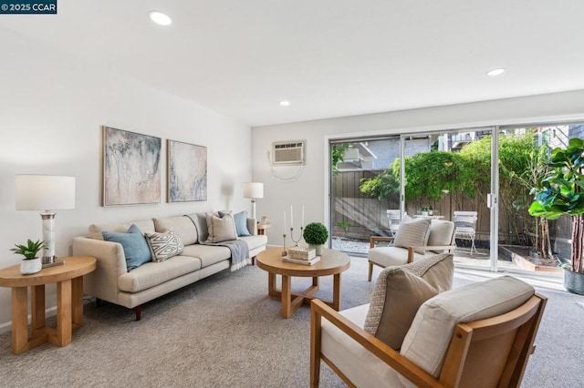 carpeted living room with a wall unit AC