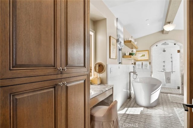 bathroom with lofted ceiling with beams and independent shower and bath