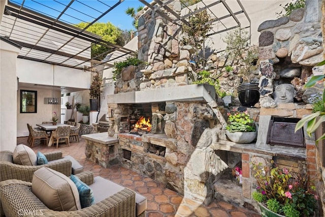 view of patio with an outdoor stone fireplace