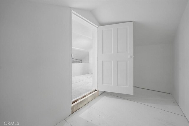 bathroom featuring vaulted ceiling