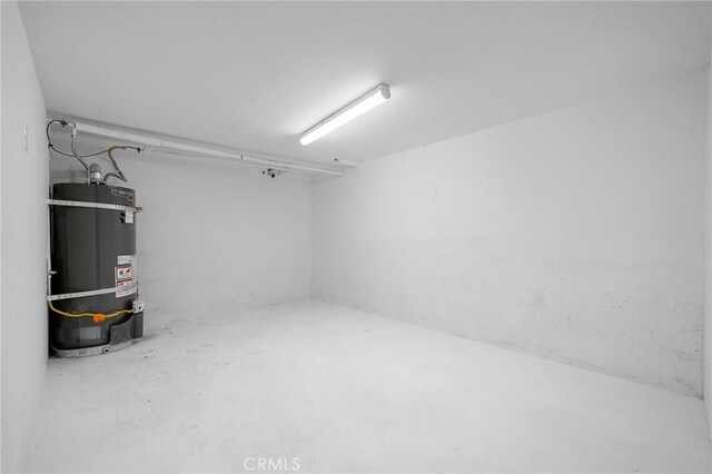 basement with strapped water heater