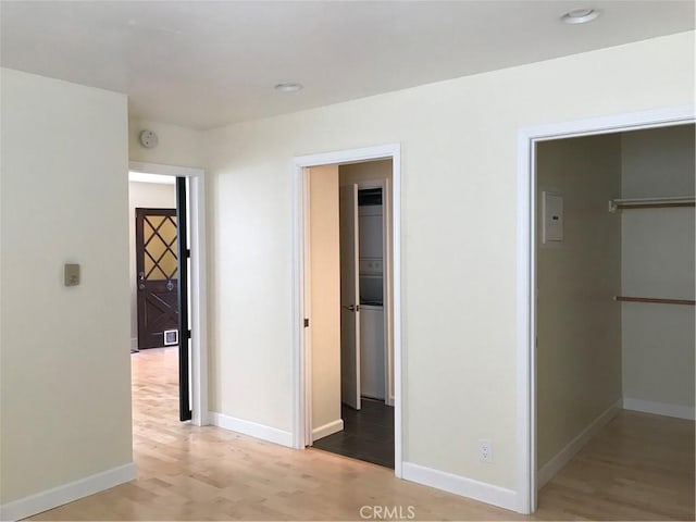 hall with light hardwood / wood-style floors