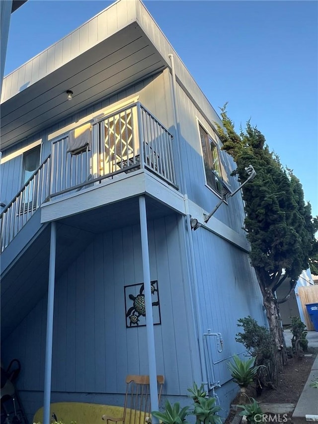 view of home's exterior with a balcony