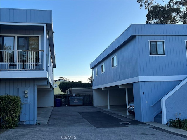 view of side of property featuring a carport