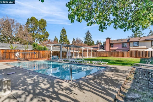 view of swimming pool with a pergola and a lawn