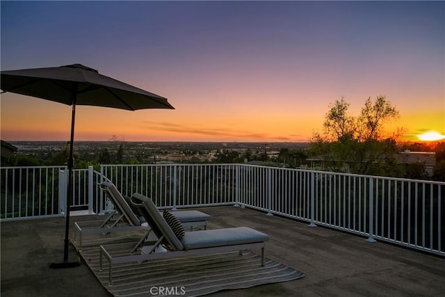 view of patio terrace at dusk