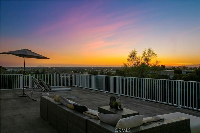 view of patio terrace at dusk