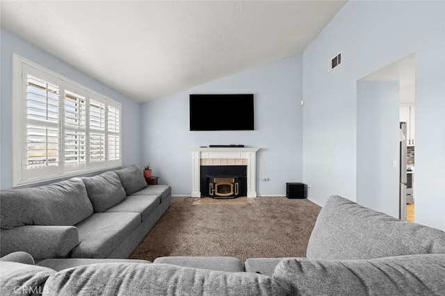 living room with vaulted ceiling and carpet