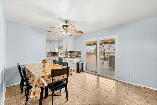 dining room featuring light tile patterned floors and ceiling fan