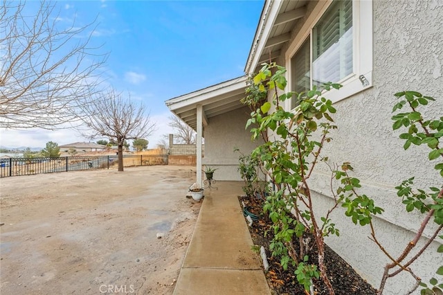 view of side of home featuring a patio