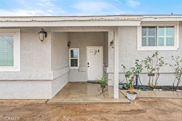 doorway to property with a patio area