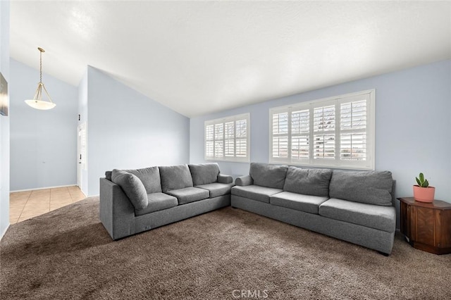 living room featuring light colored carpet and lofted ceiling