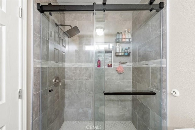 bathroom featuring an enclosed shower