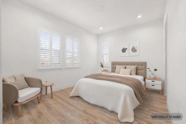 bedroom with light wood-type flooring