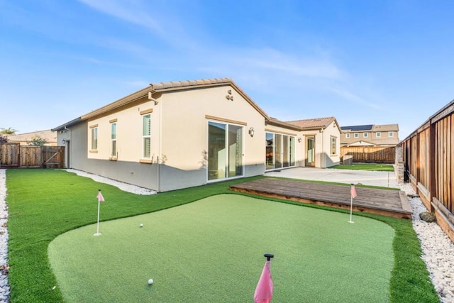 rear view of property featuring a patio