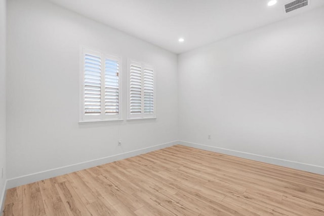 unfurnished room featuring light wood-type flooring