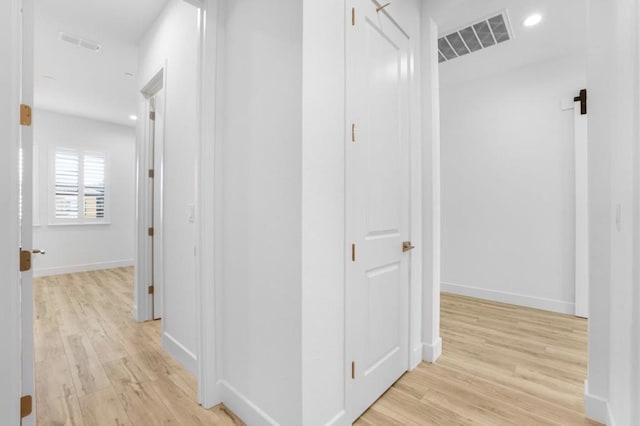 hallway featuring light hardwood / wood-style flooring