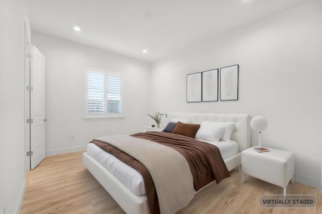 bedroom featuring light hardwood / wood-style flooring