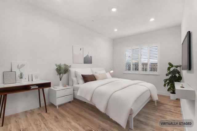 bedroom featuring light wood-type flooring