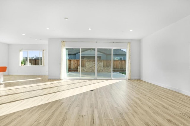 unfurnished living room with light hardwood / wood-style flooring