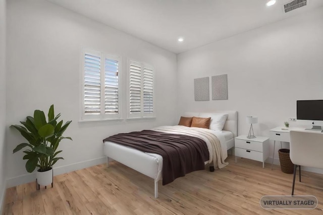 bedroom featuring light hardwood / wood-style floors