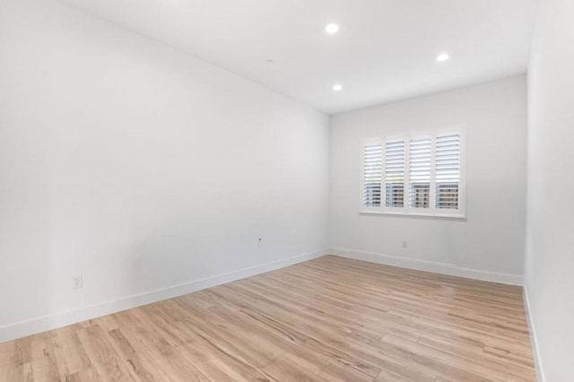 spare room with light hardwood / wood-style floors